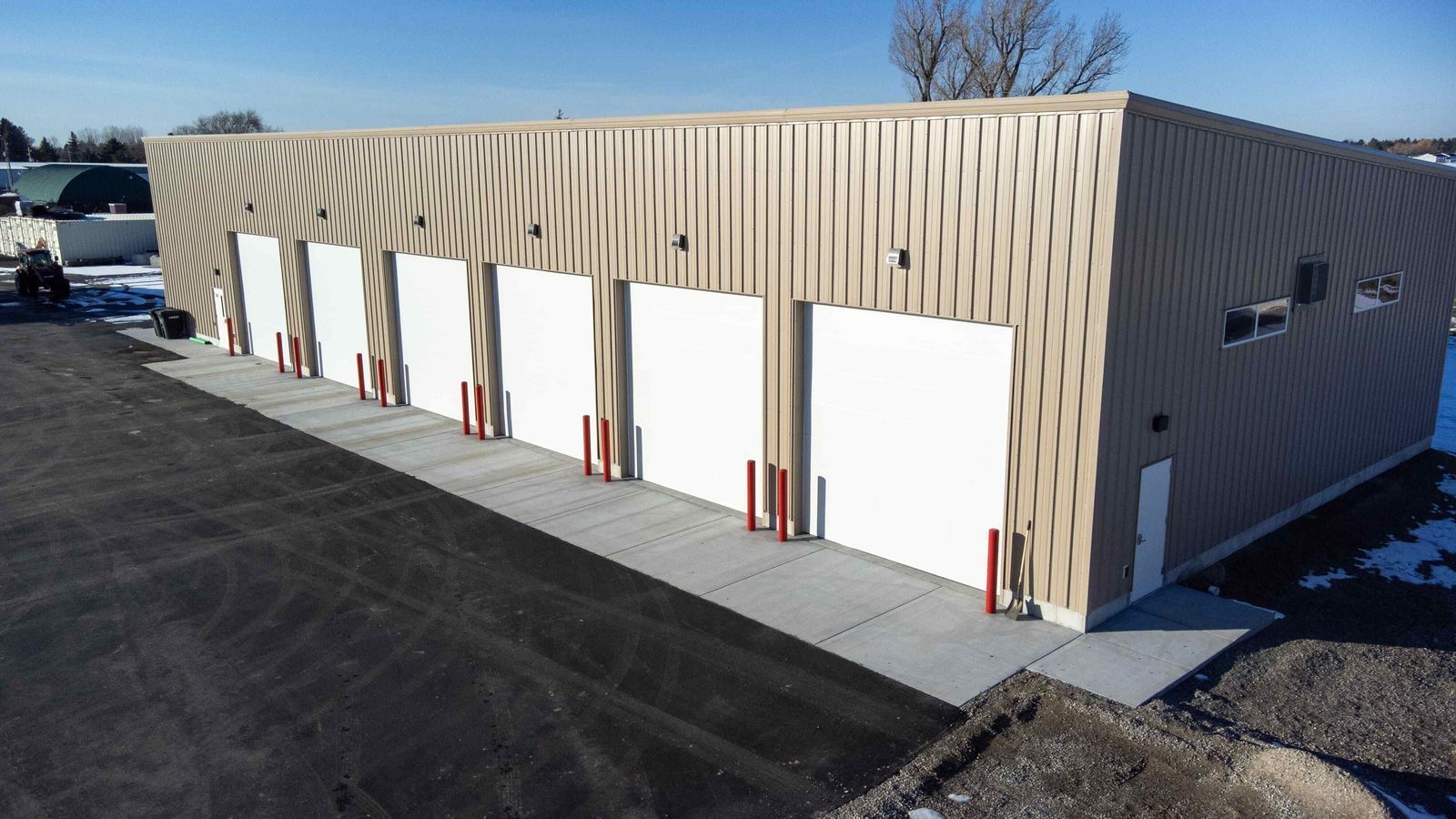 A large building with a lot of garage doors on it