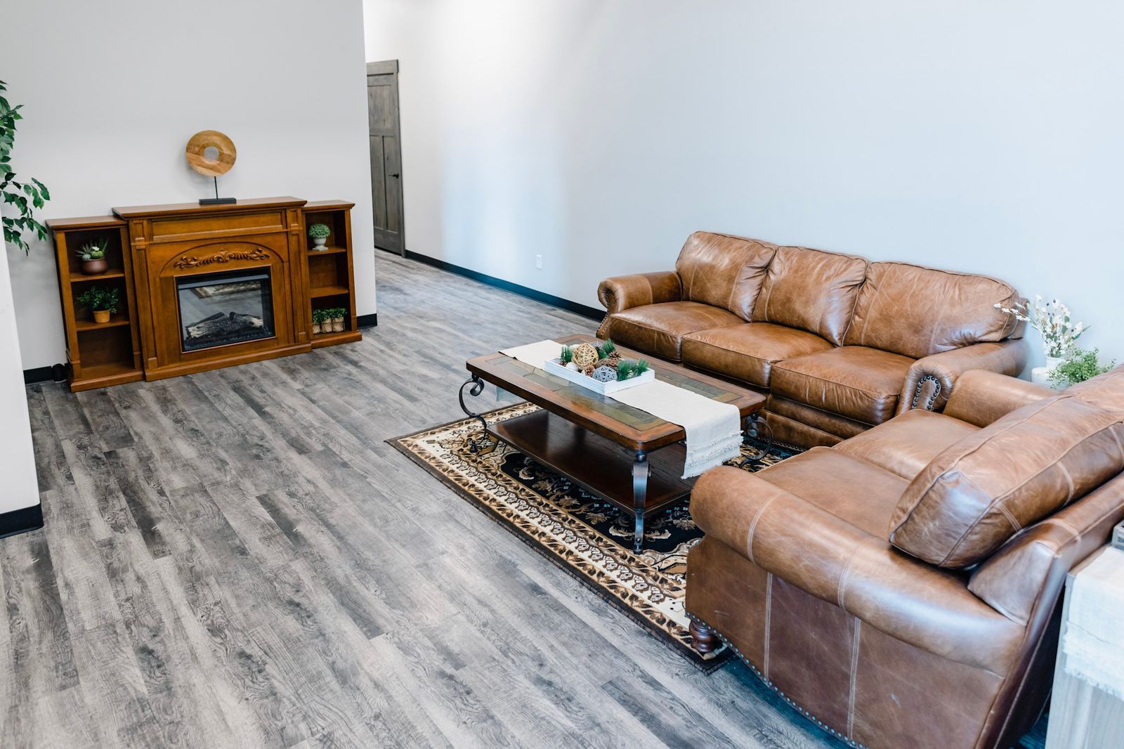 A living room filled with furniture and a fireplace
