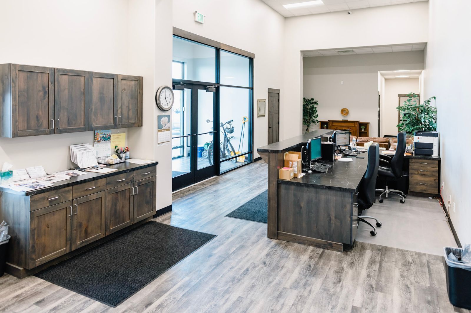 A large room with a desk and cabinets in it
