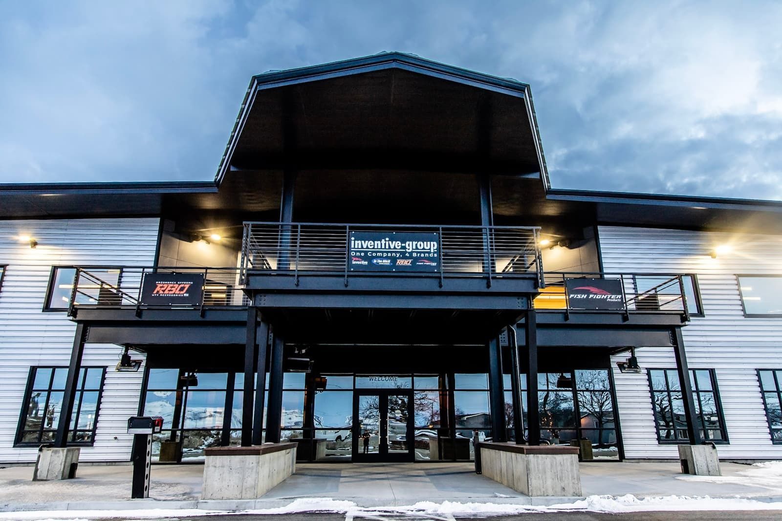 A large building with a balcony and a sign that says open