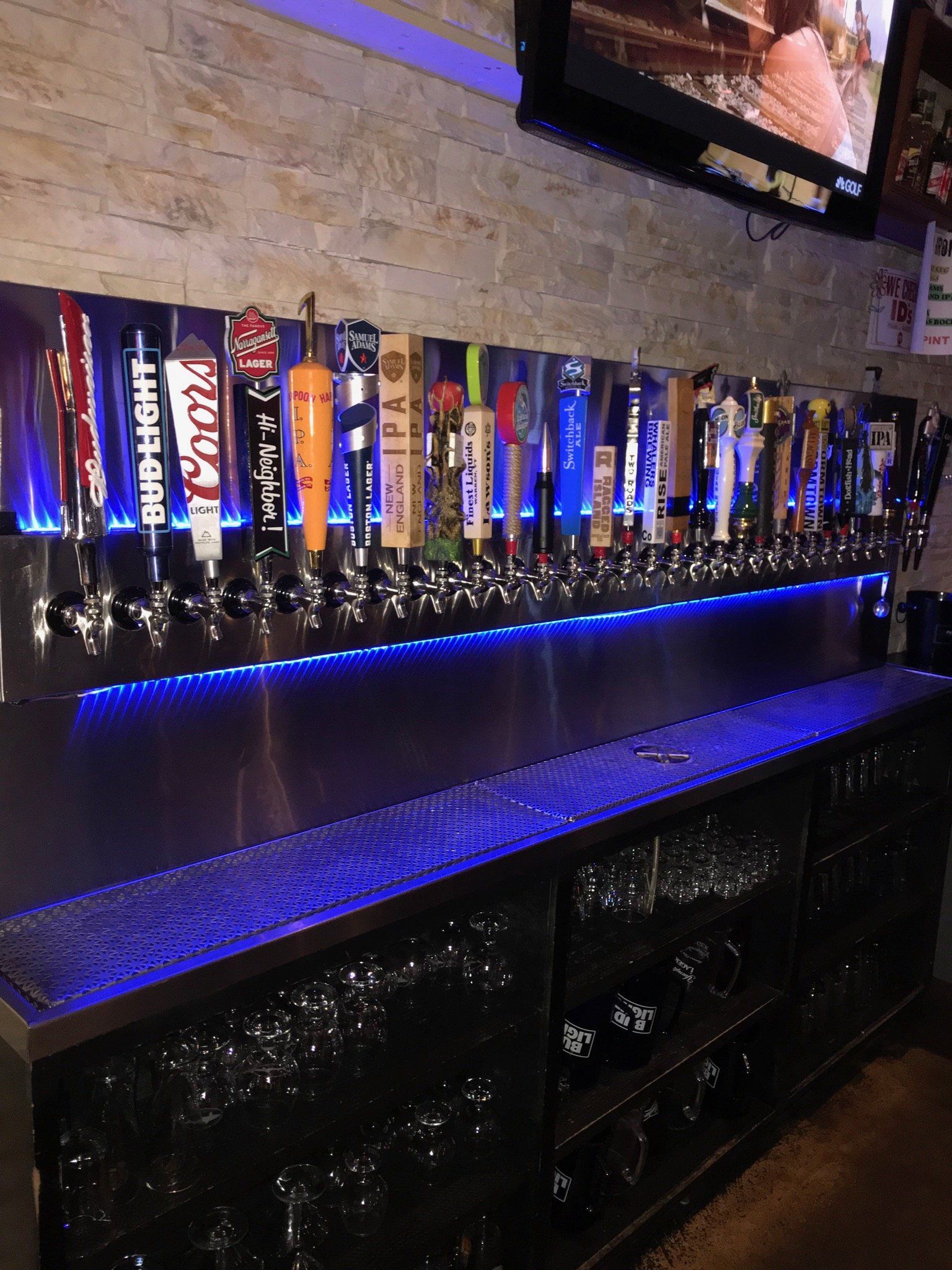 A bar with a lot of beer taps on it