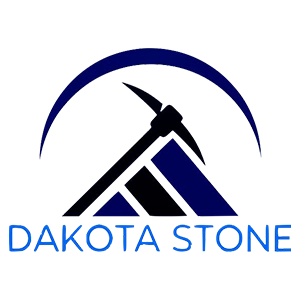 Logo for Dakota Stone: blue and black pickaxe over a geometric mountain shape, beneath a dark blue arch. Text at the bottom.