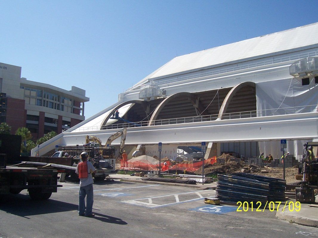Construction worker in front of a building