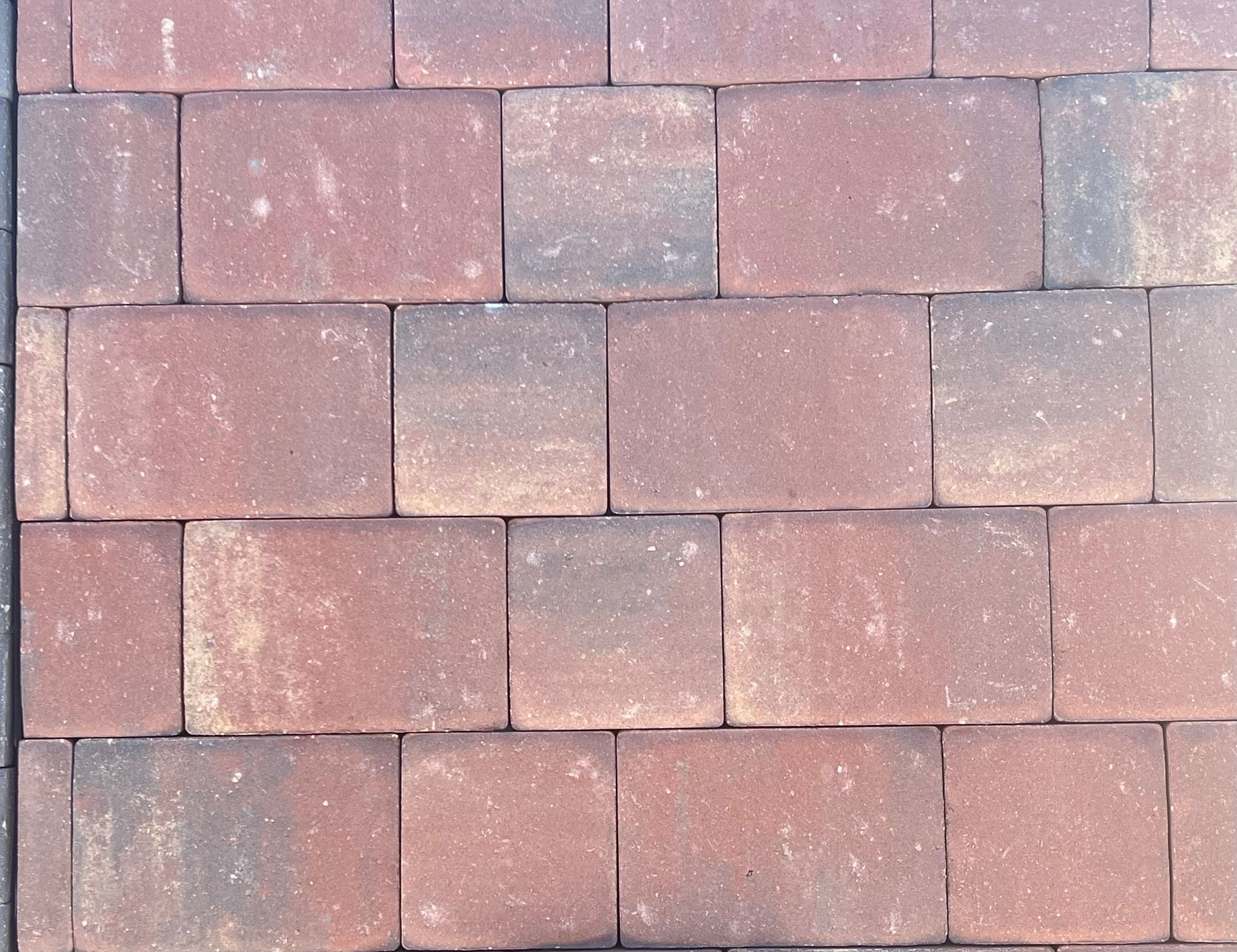 A close up of a row of red bricks