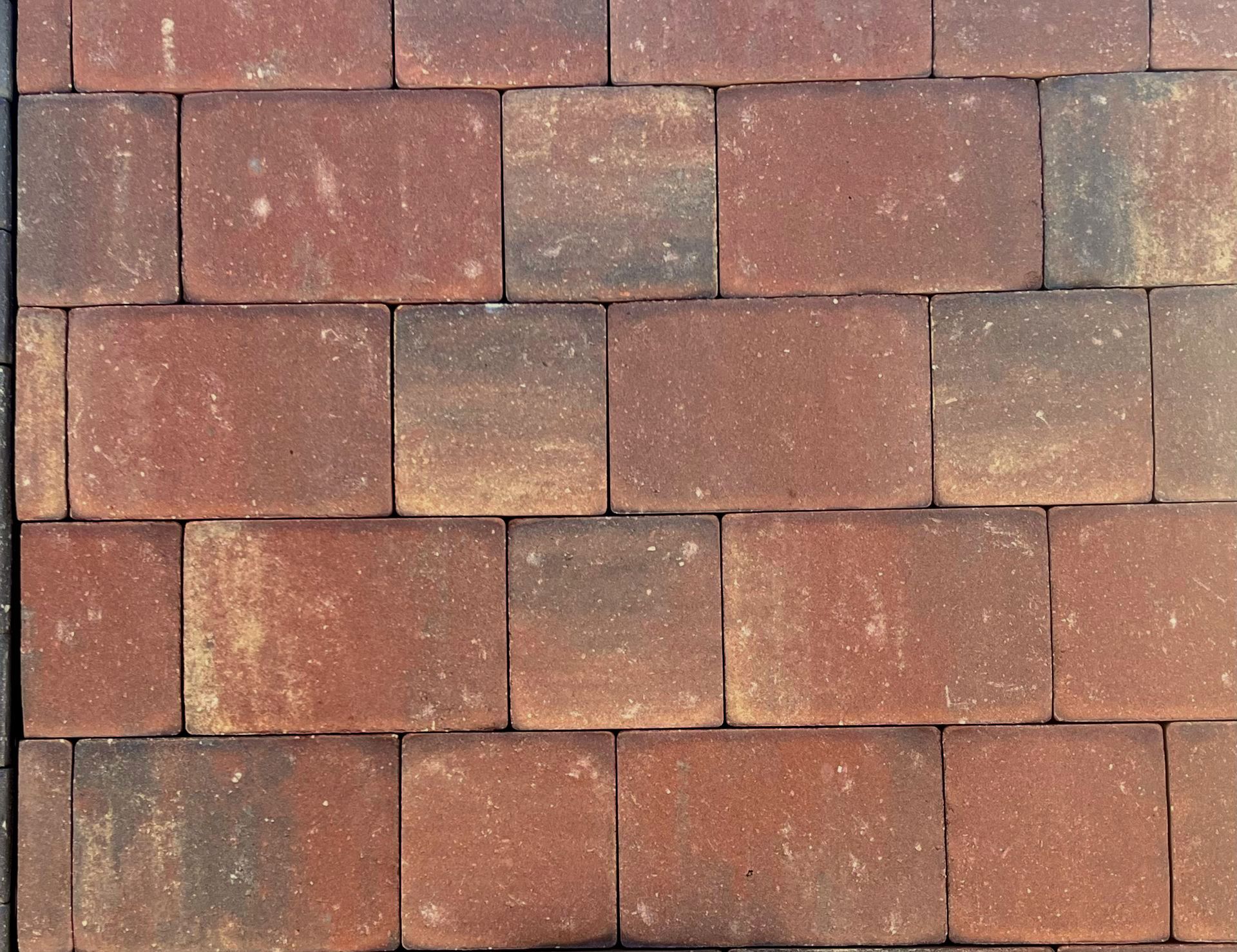 A close up of a row of red bricks