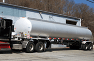Oil tank truck in front of store