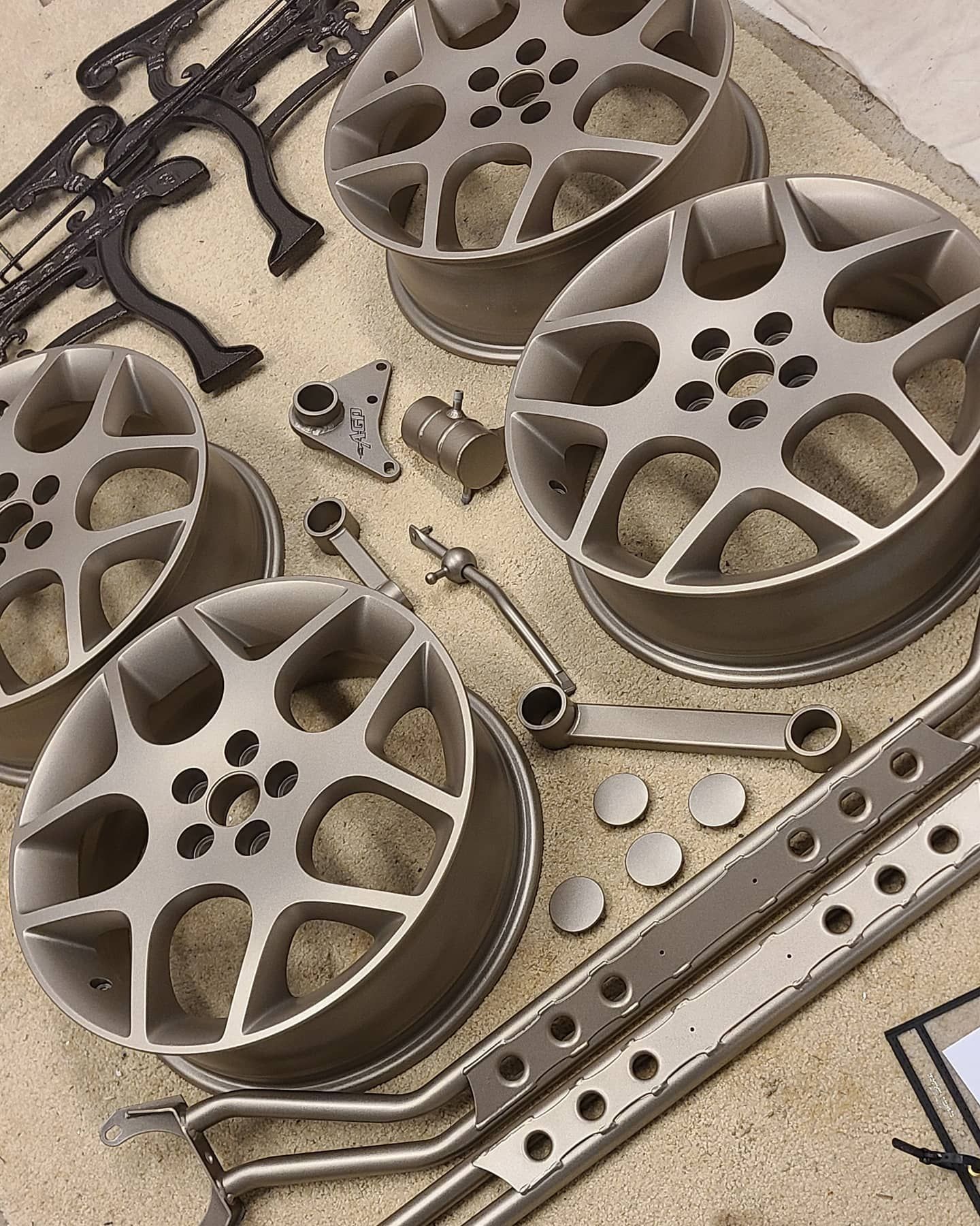 A bunch of wheels are sitting on top of each other on a table.