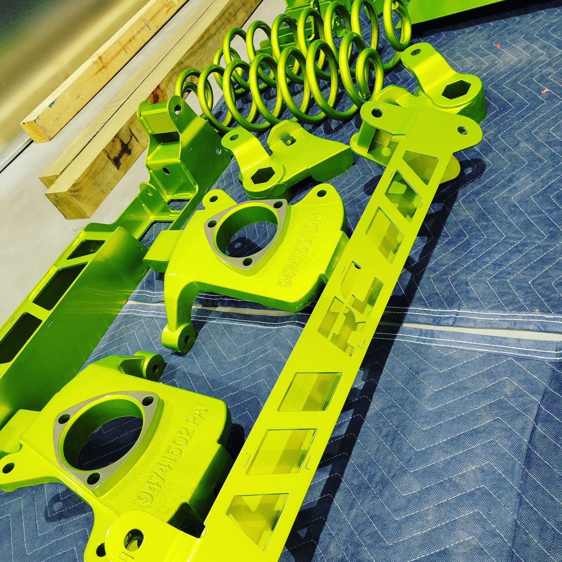 A bunch of green metal pieces with the word r on it