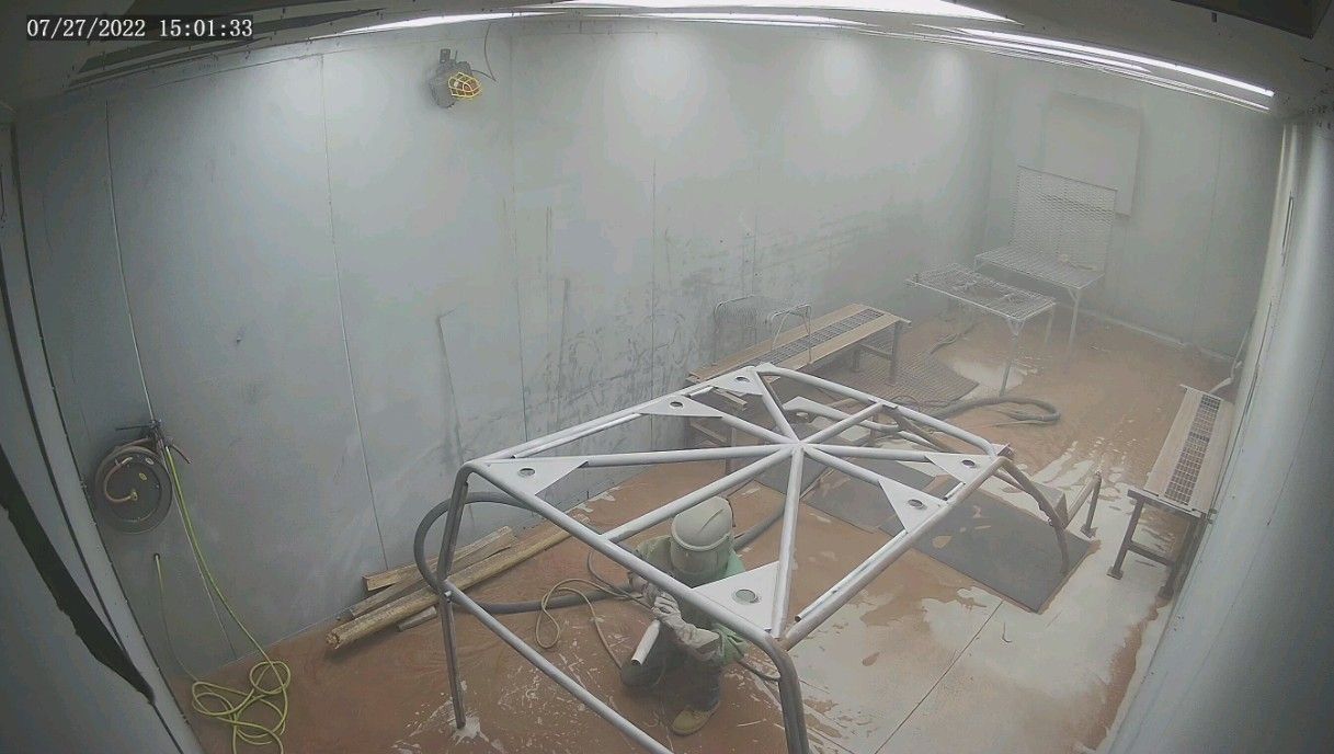 A room with a table in it and a lot of smoke coming out of it.