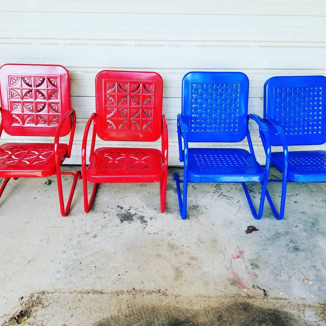 Four red and blue chairs are lined up in a row