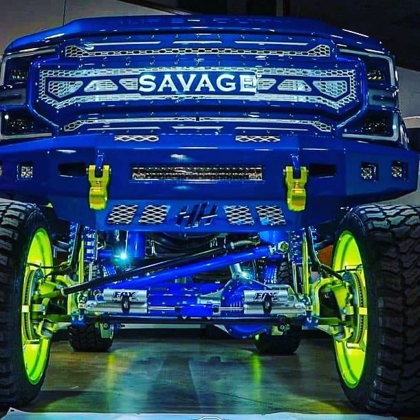 A blue truck with the word Savage on it