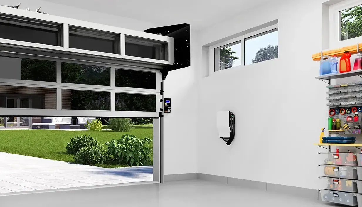 Modern garage interior with open black sectional door, wall-mounted opener, and storage shelves on the right.