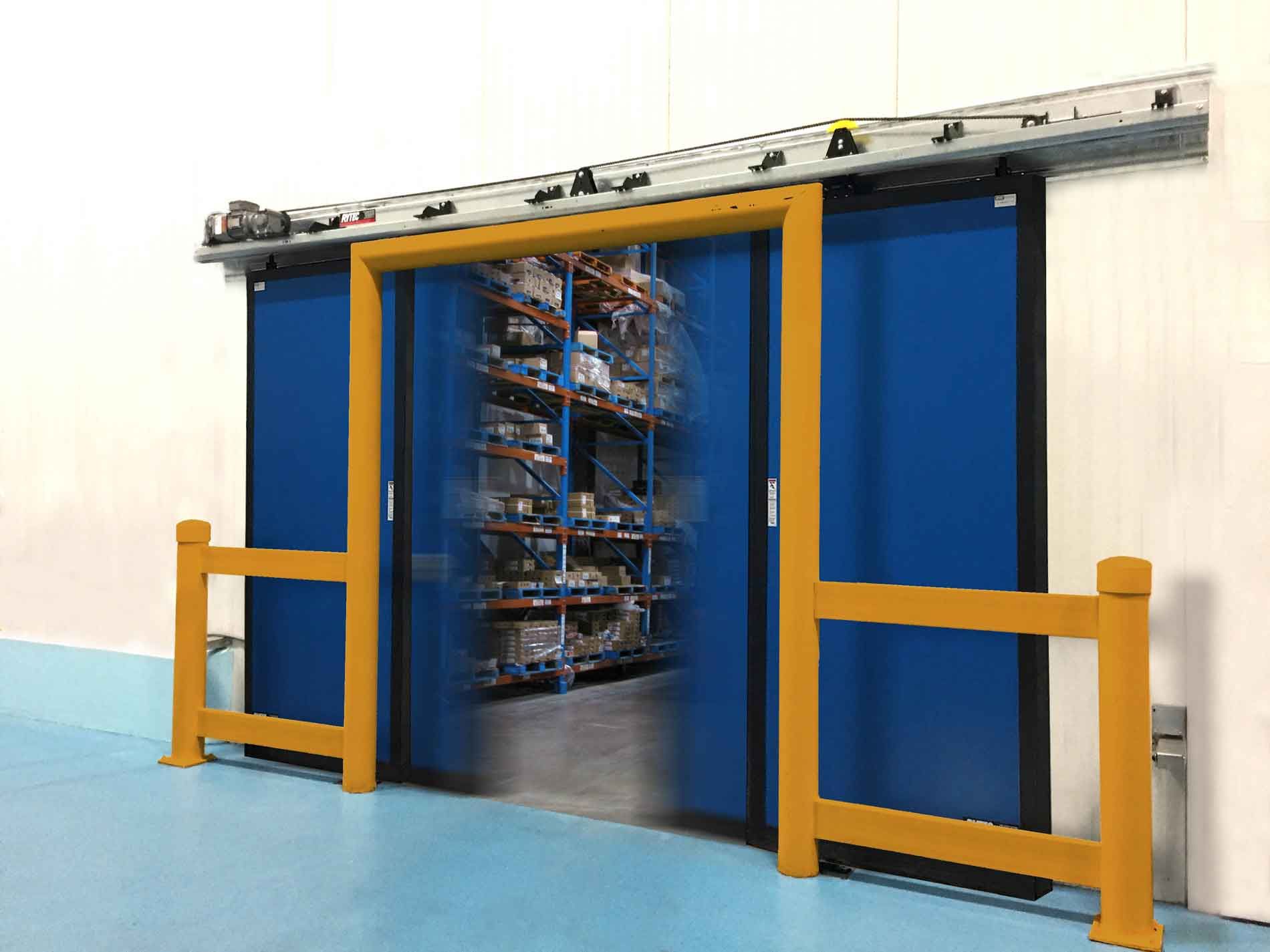Blue sliding warehouse door opening, revealing storage shelves. Yellow frame and safety rails.