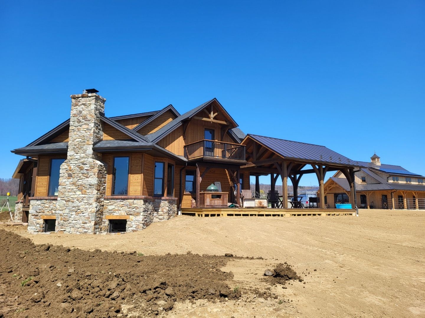 Rustic timber-and-stone house with a covered porch