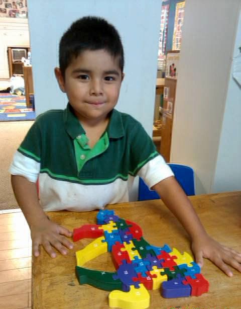 Child learning to build blocks