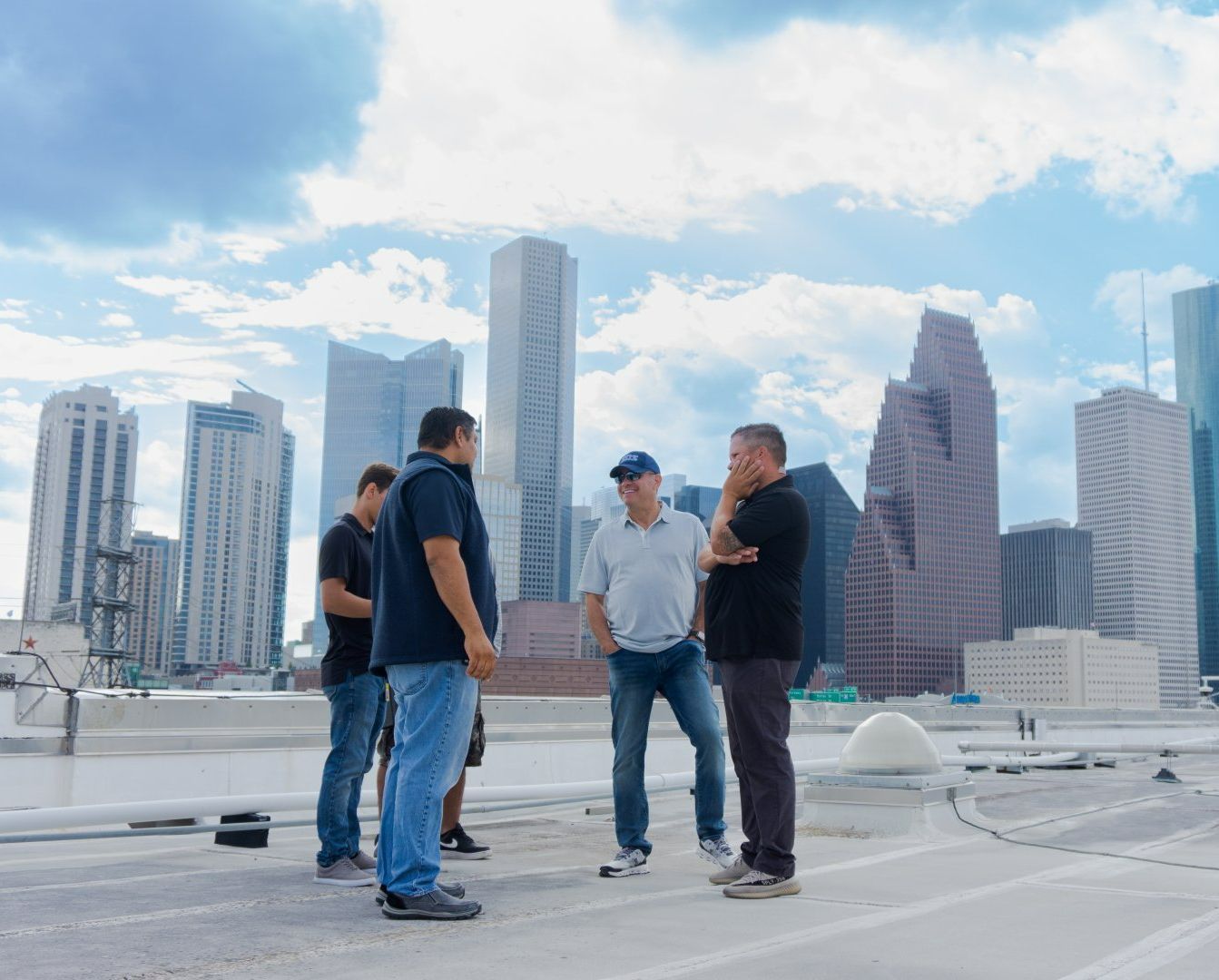 Four men talking to each other