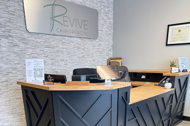 A reception desk in the Revive Chiropractic office