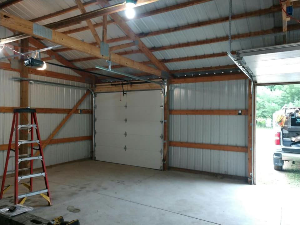 Sandy surface with curved, parallel ridges and shadows.