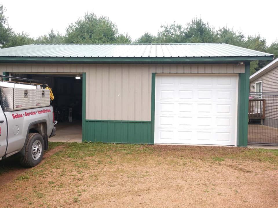 Aerial view of a winding river flowing through a lush green forest.