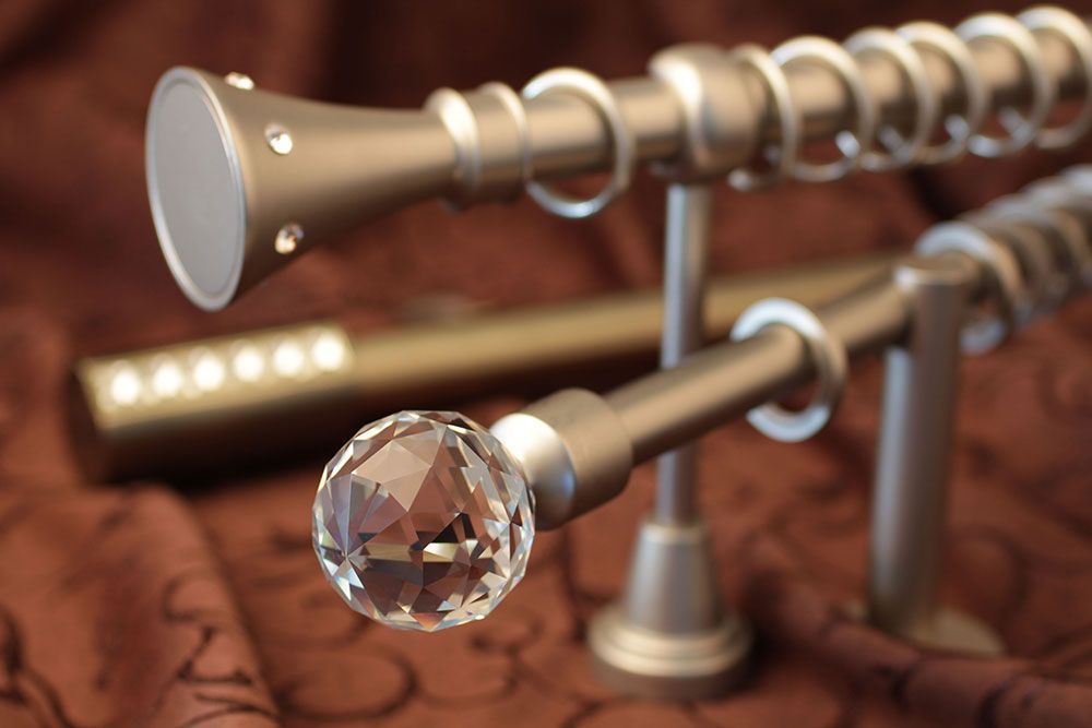 A pair of curtain poles with crystals on them