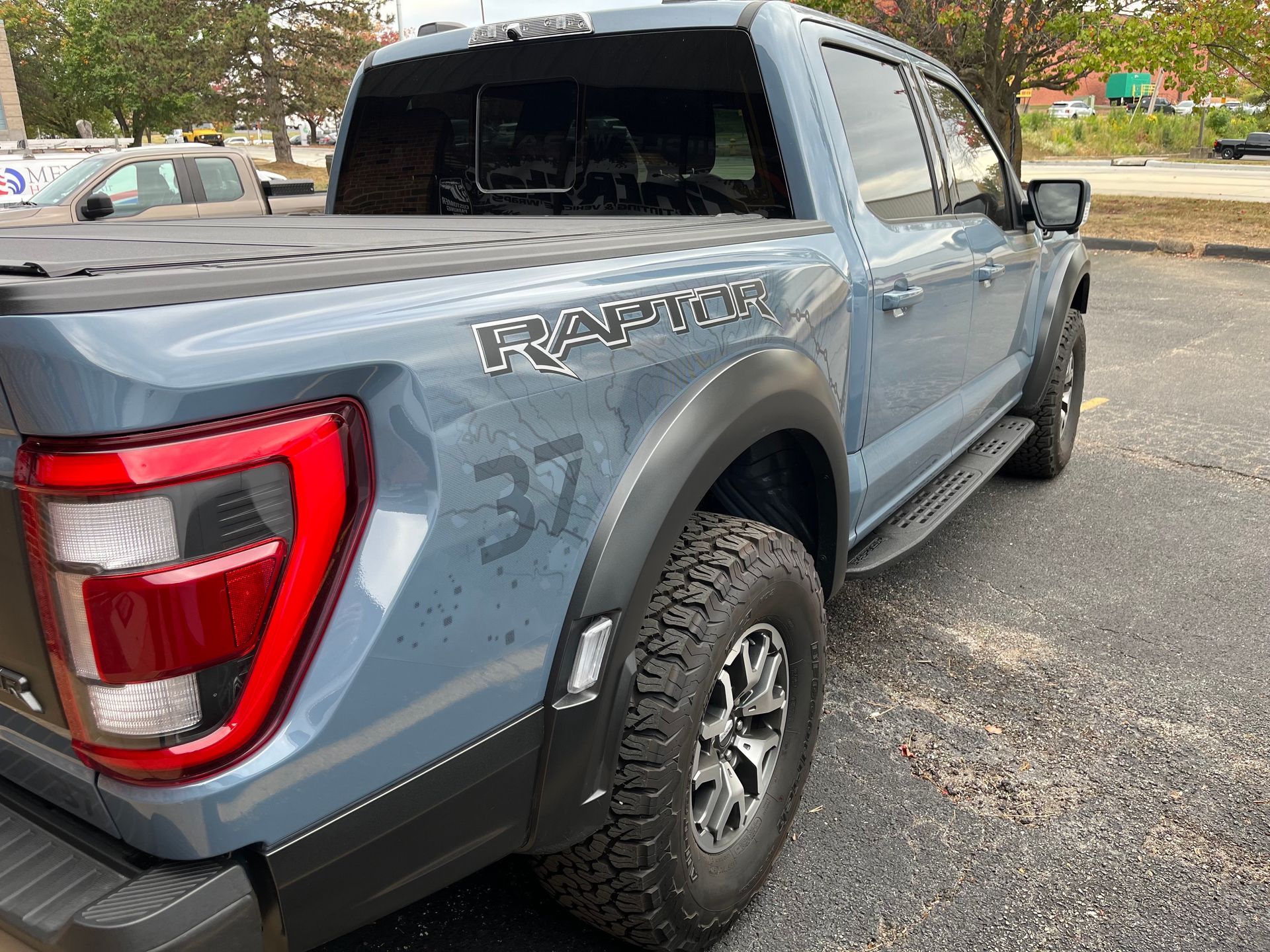 Blue Ford Raptor truck with 