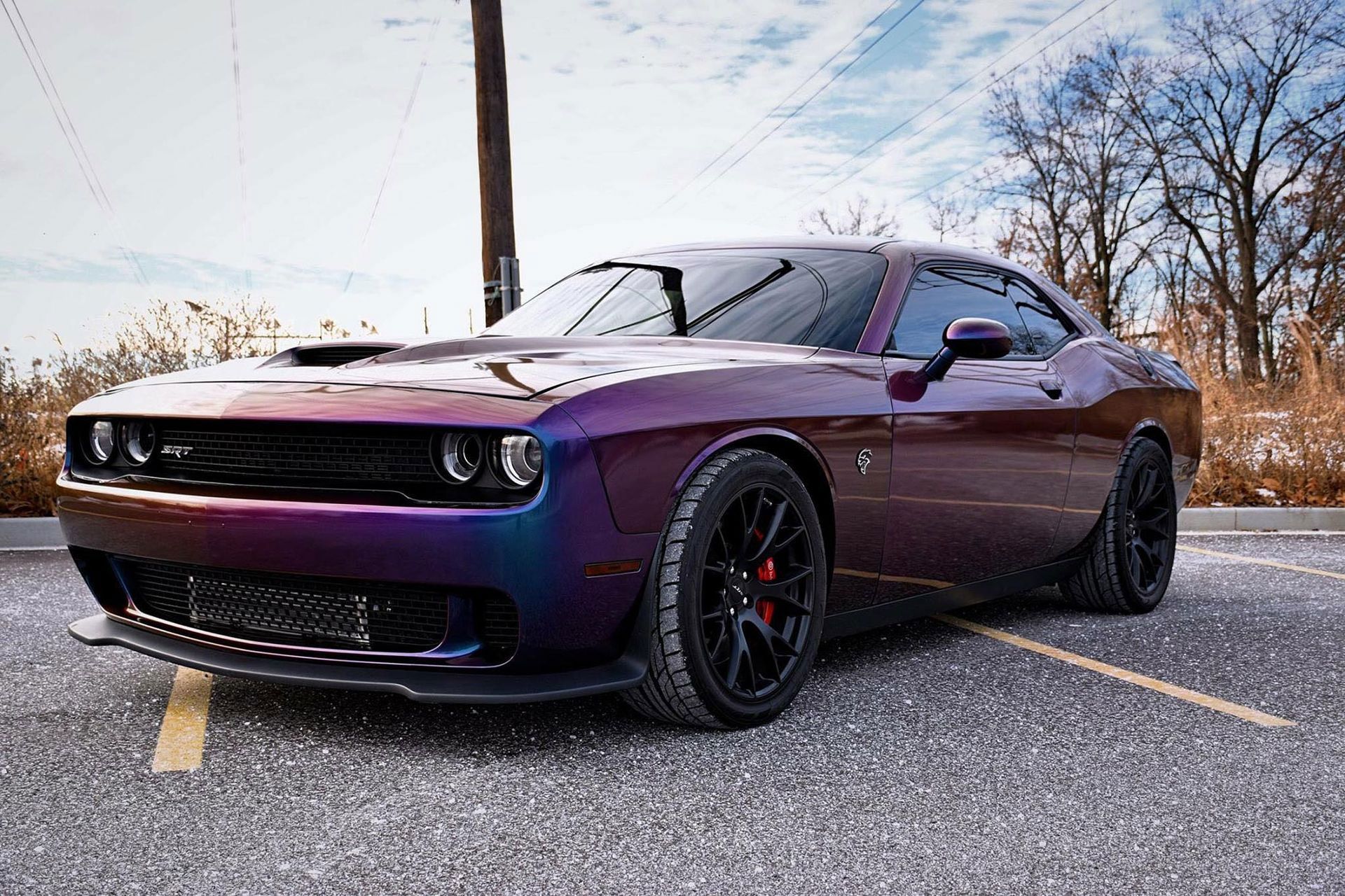 Purple Dodge Challenger parked on pavement.