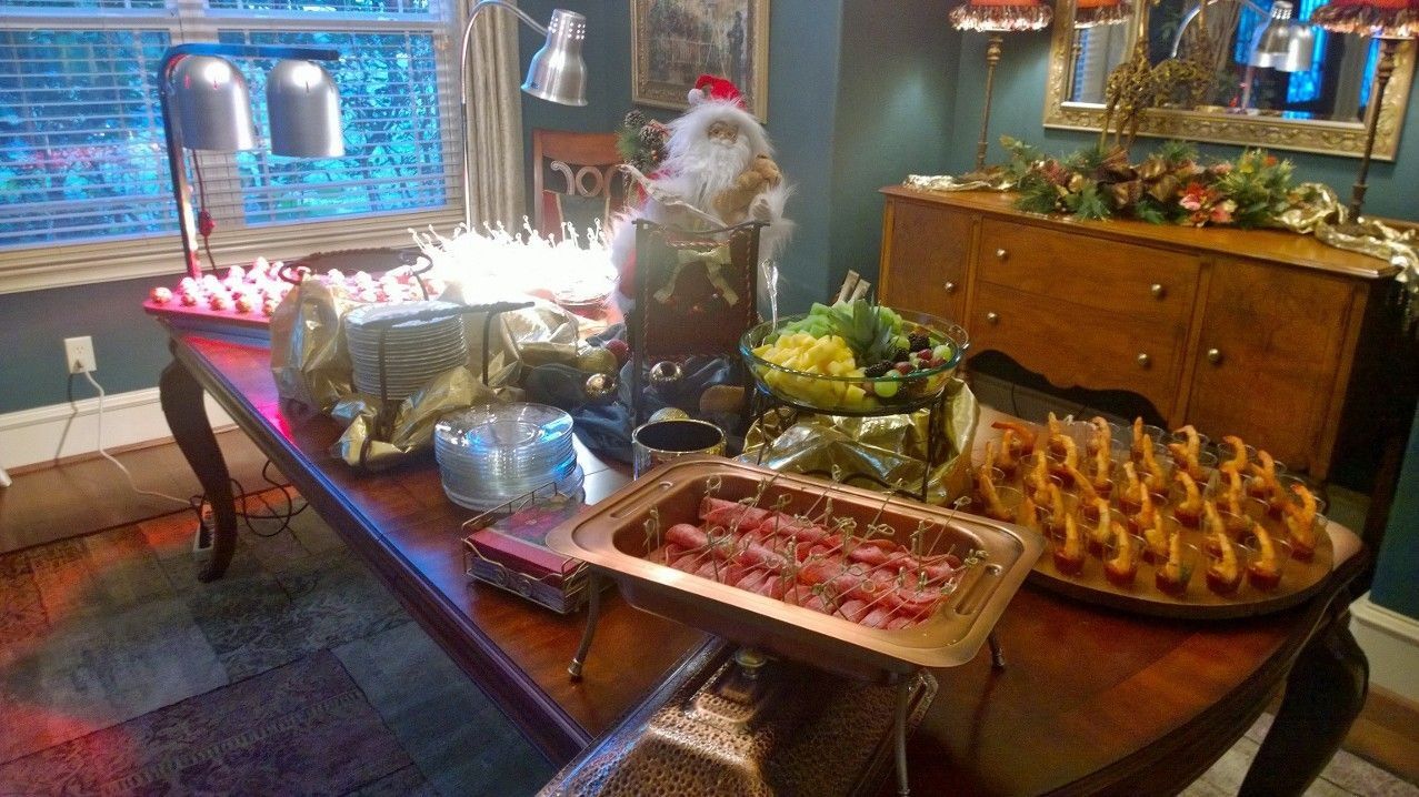 There is a table with a lot of food on it.