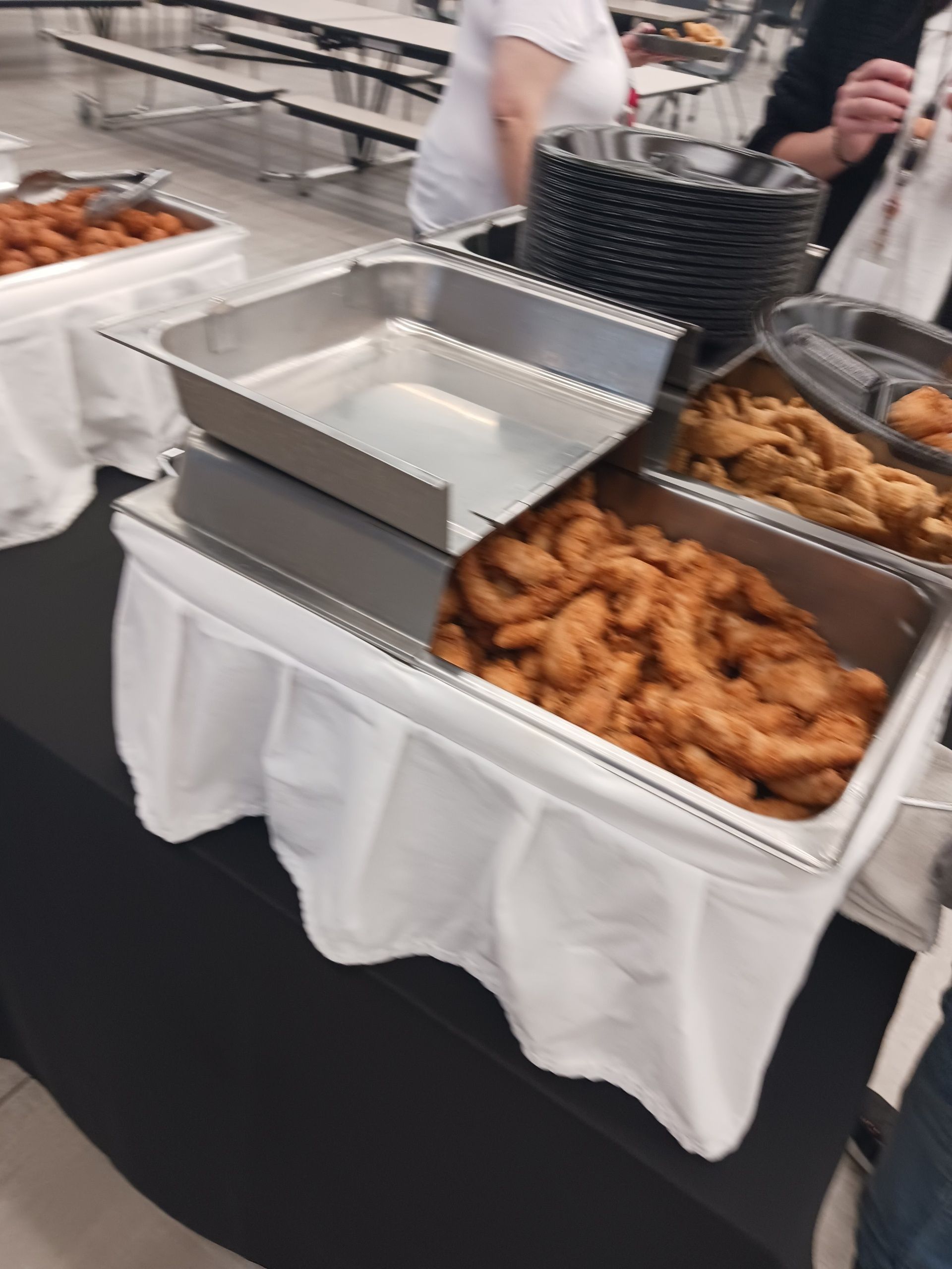 A buffet table with a variety of food on it