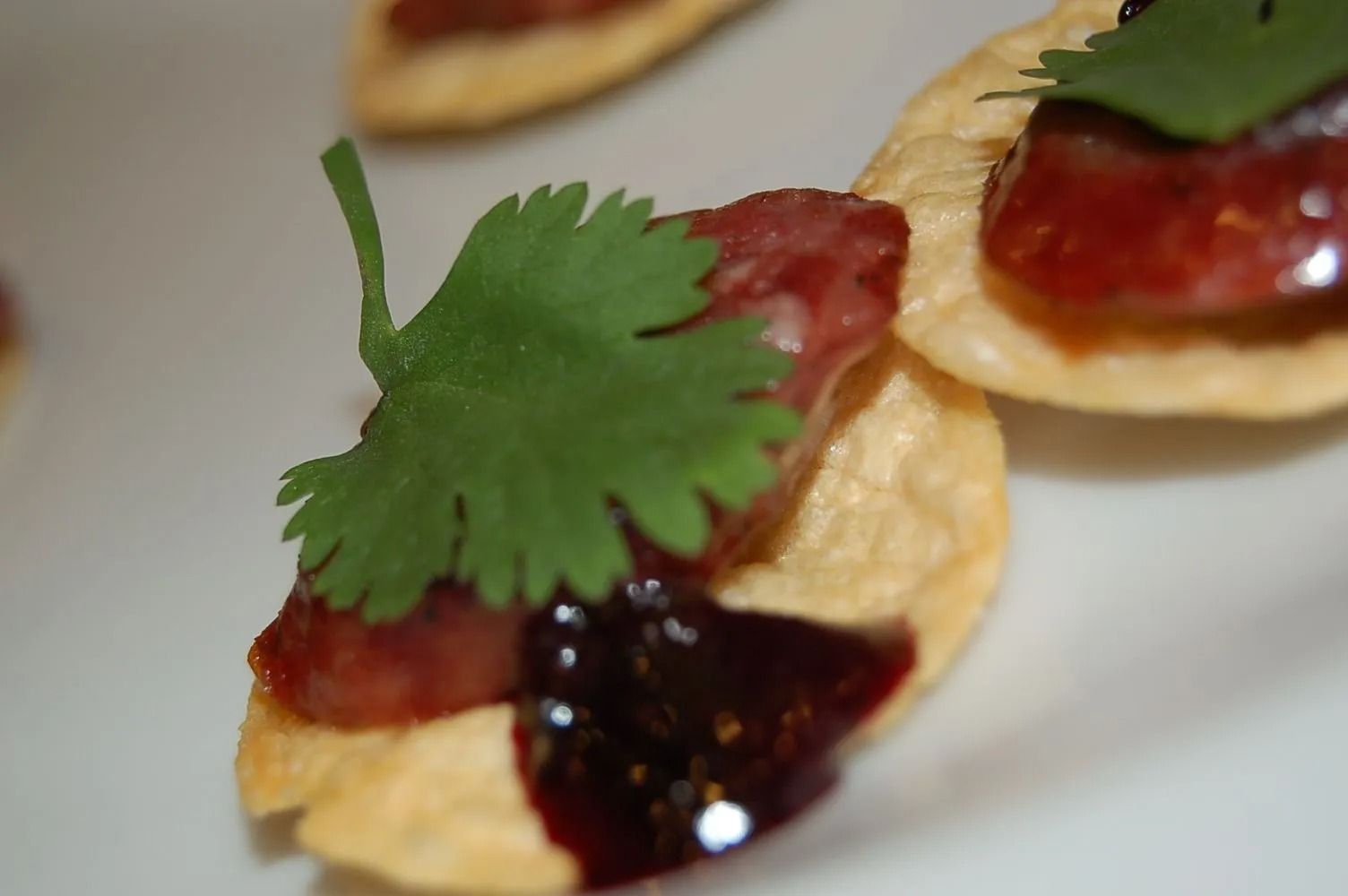 A close up of a plate of food with a leaf on top