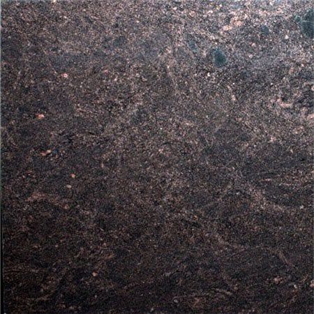 Dark brown granite with copper-colored speckles and veining, close-up.