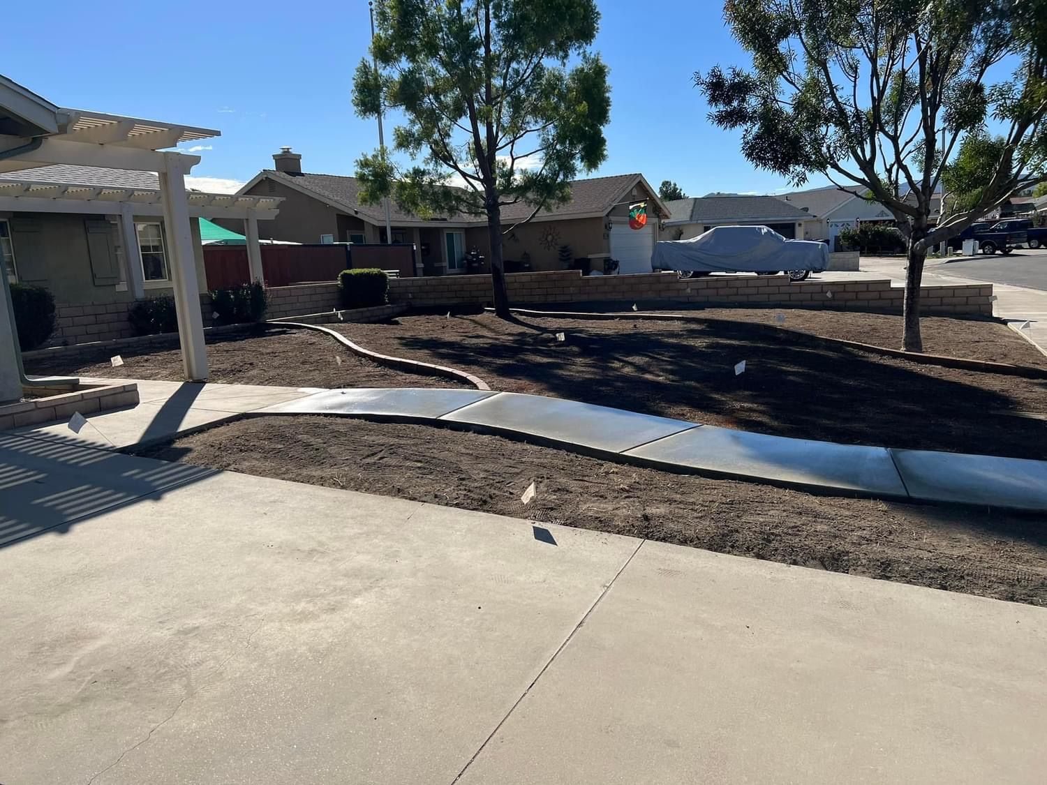 a concrete walkway is being built in front of a house