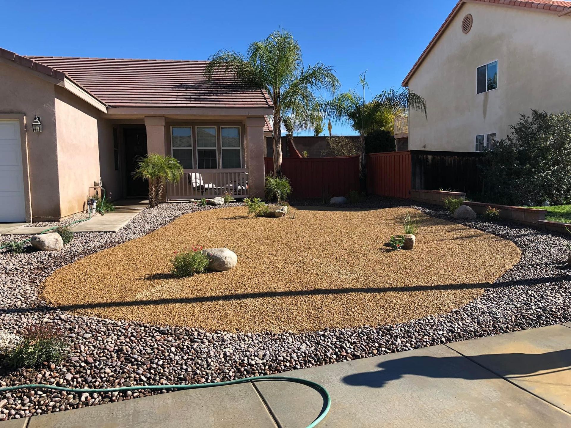 a house with a hose in front of it