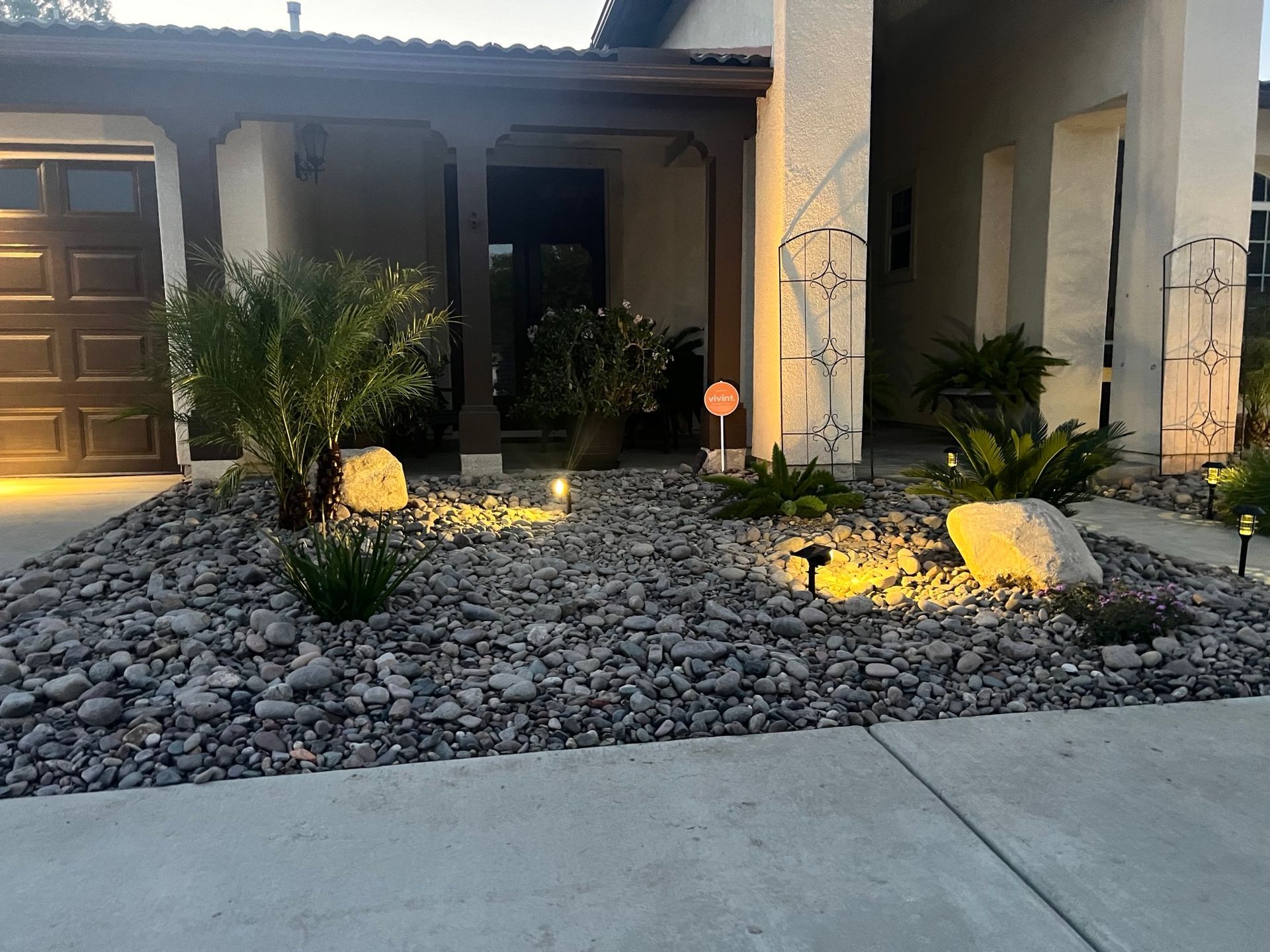 a house with a lot of rocks in front of it