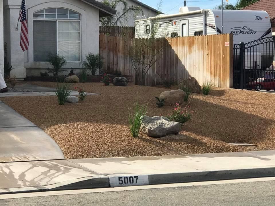 a house with an RV parked in front of it