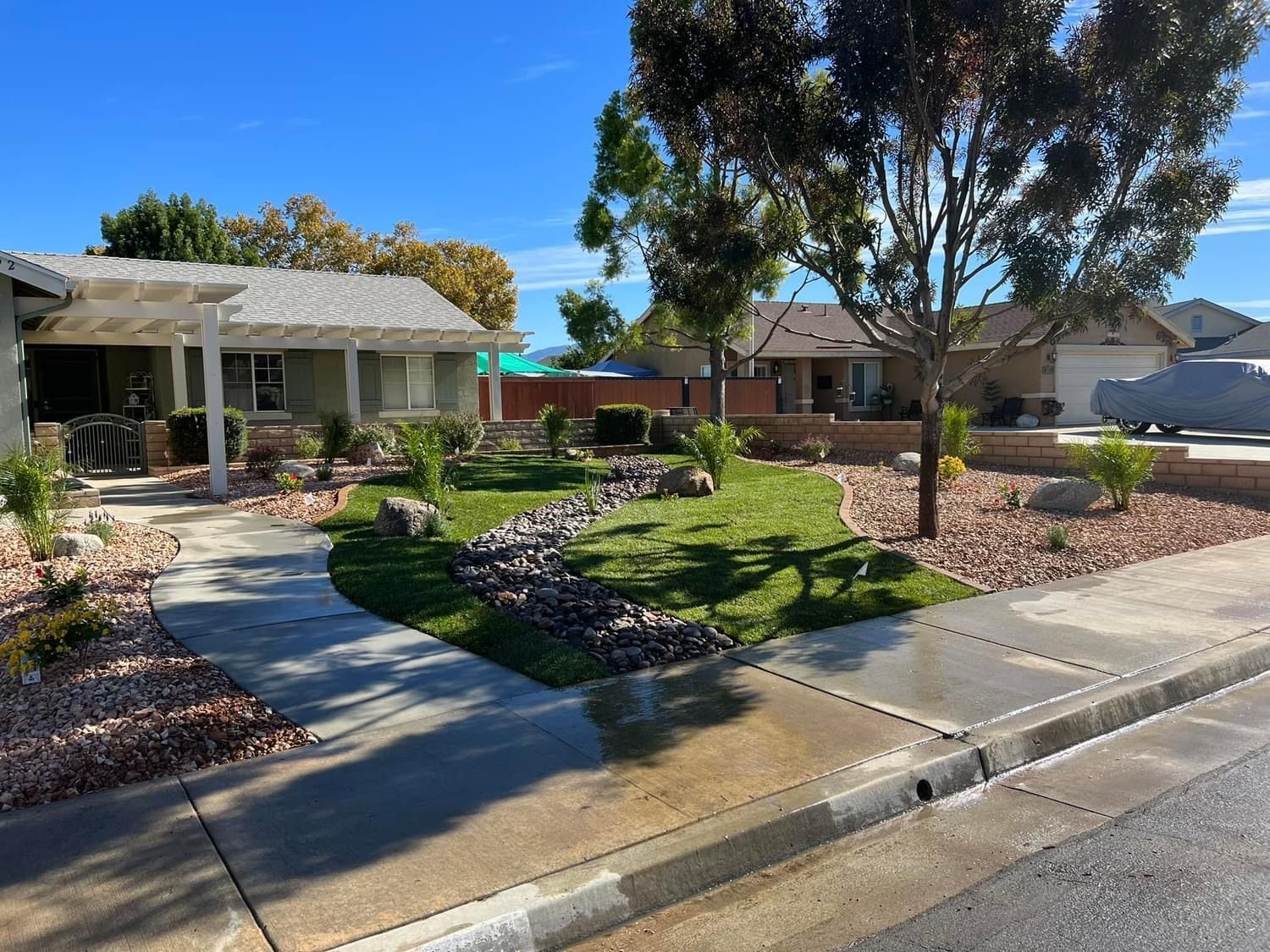 a house with a covered porch and a lush green yard