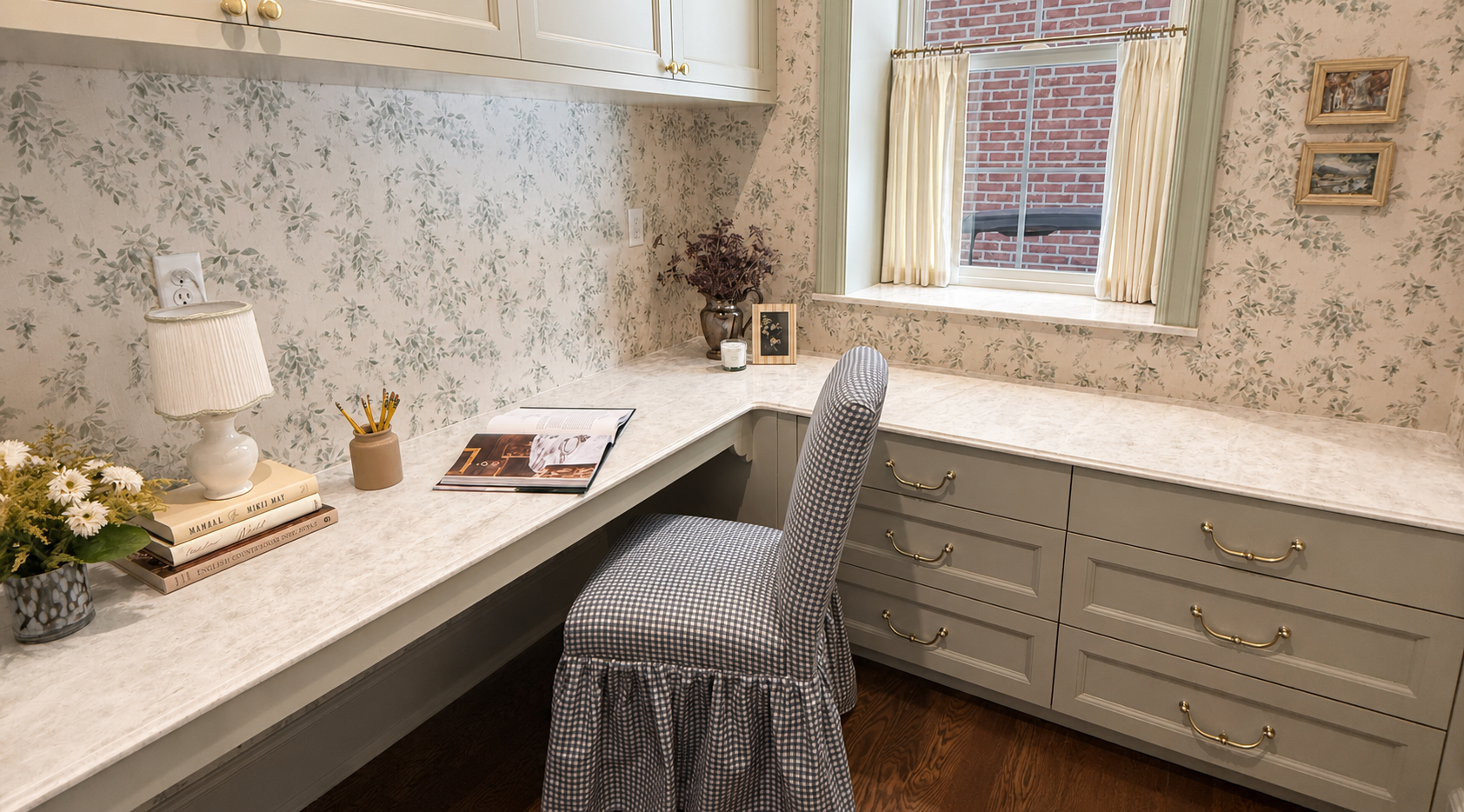 Bright home office with floral wallpaper, a desk by the window, and a patterned chair.