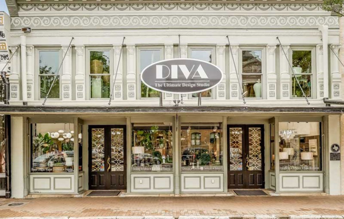 Storefront of DIVA boutique with ornate white facade and large display windows