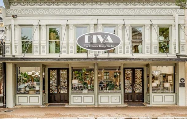 Storefront of DIVA boutique with ornate white facade and large display windows