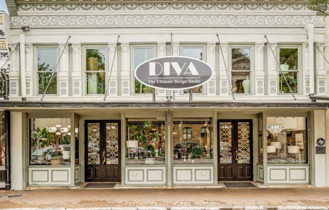 Storefront of DIVA boutique with ornate white facade and large display windows