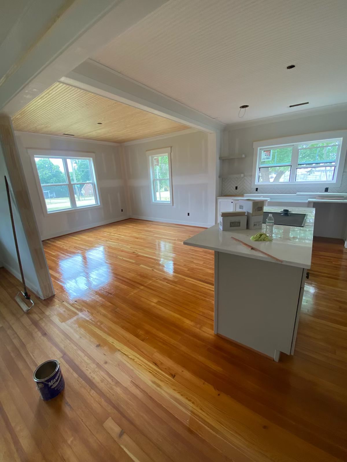 A kitchen with hardwood floors