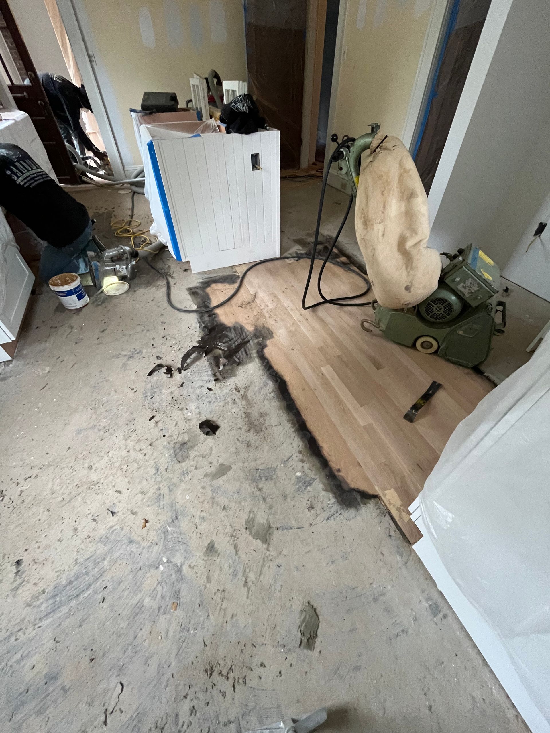 A room with a broken wooden floor.