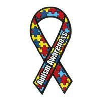 Autism awareness ribbon with a colorful puzzle piece pattern featuring red, yellow, and blue colors.