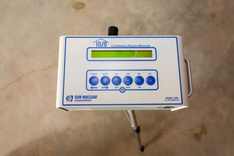 A white and blue device with the number 1036 on it