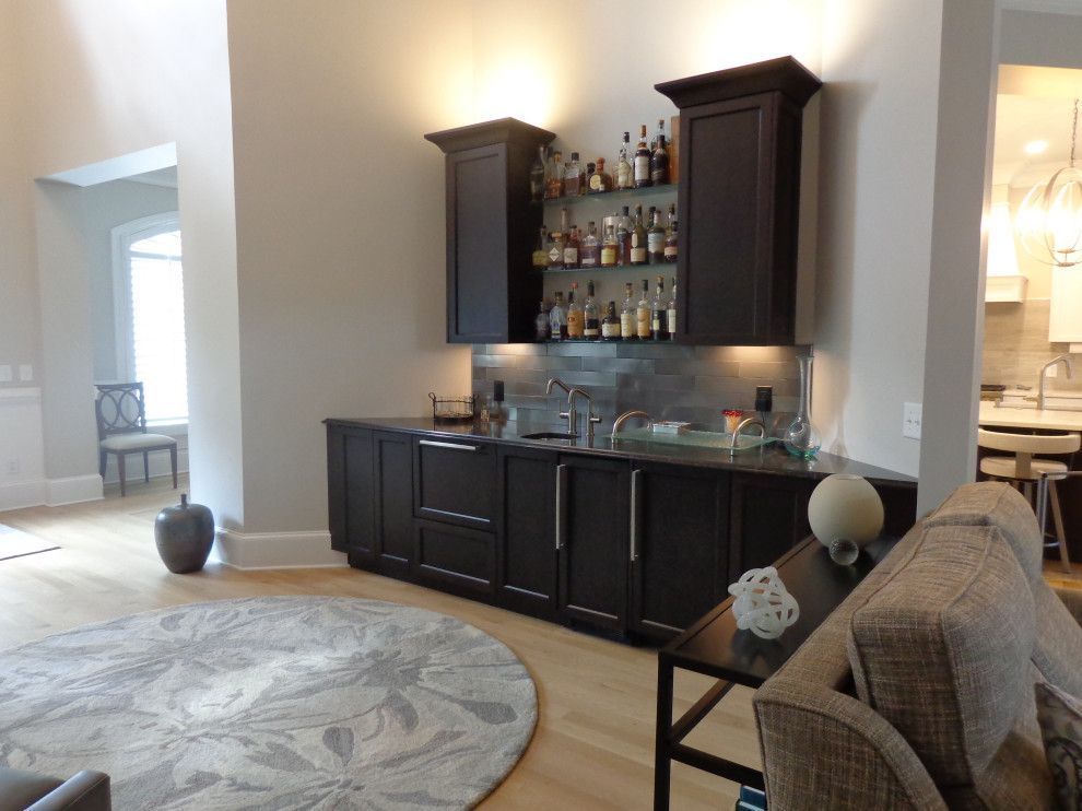 A living room with a bar and a couch.