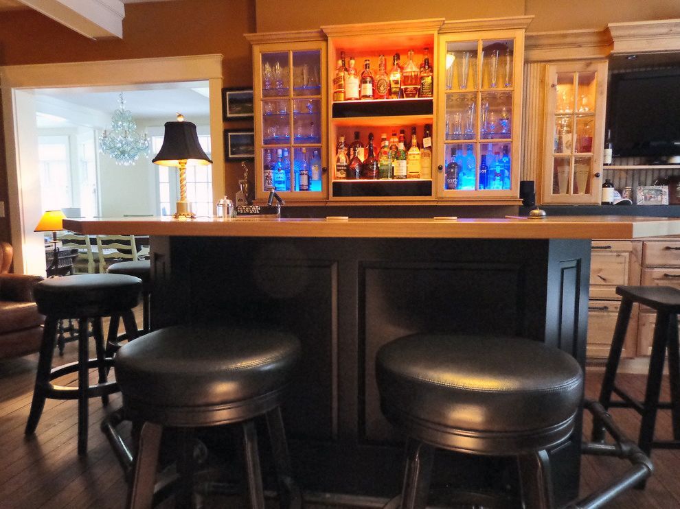 A bar with a lot of bottles on it.