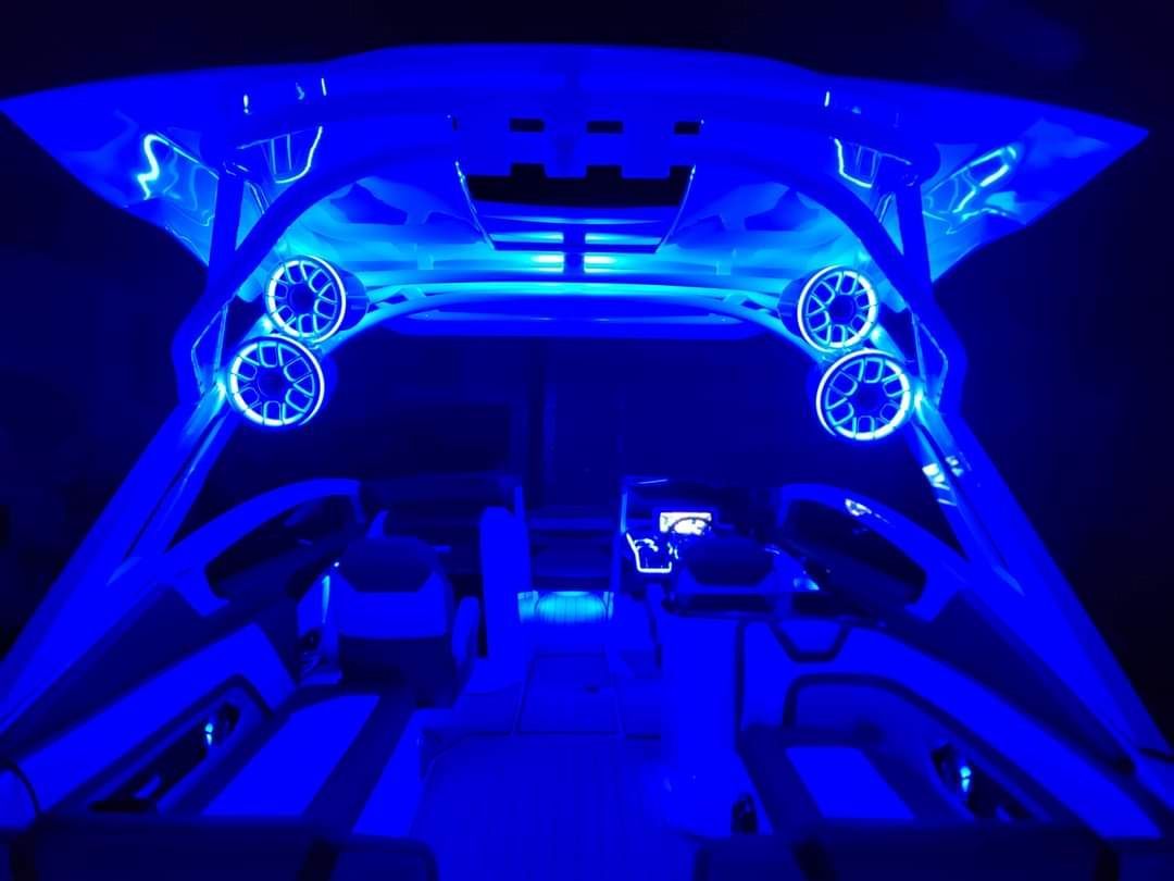 The inside of a boat with blue lights on it
