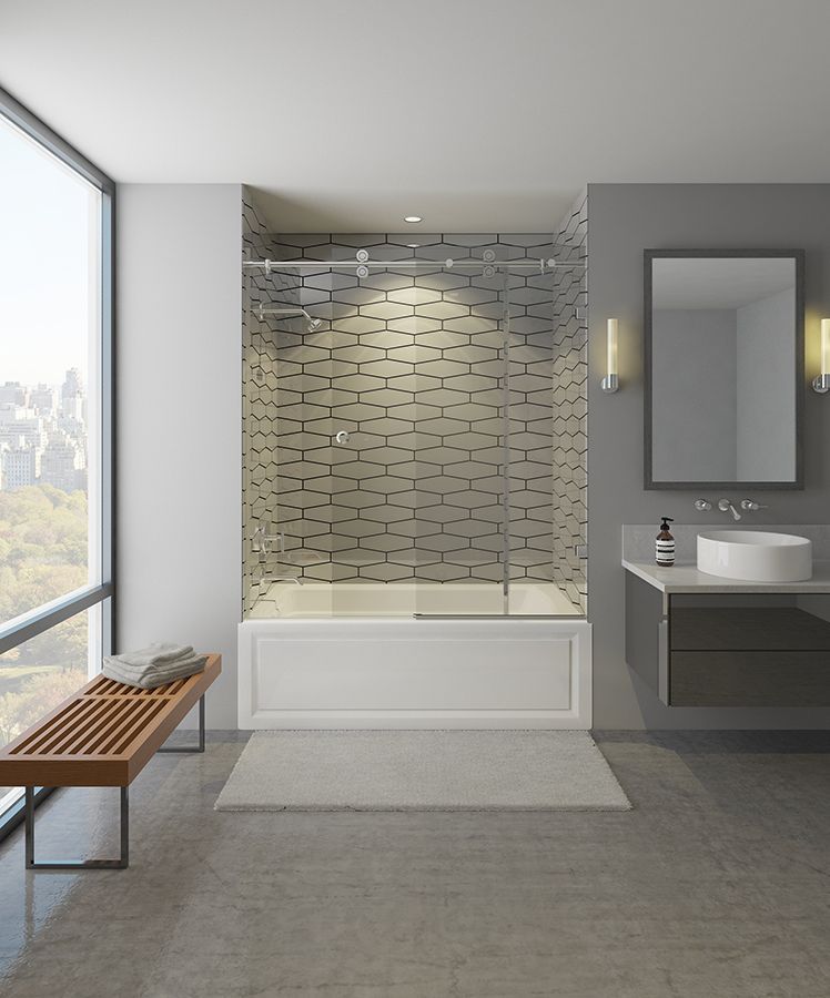 Modern bathroom with tub and shower, gray walls, wooden bench by large window.