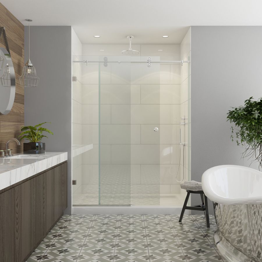 Modern bathroom with glass shower, tub, wood vanity, patterned tile floor, and plants.