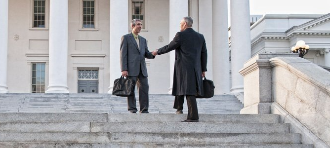 Two attorneys shaking hands