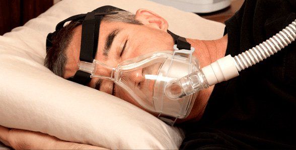 Man using modern nebulizer